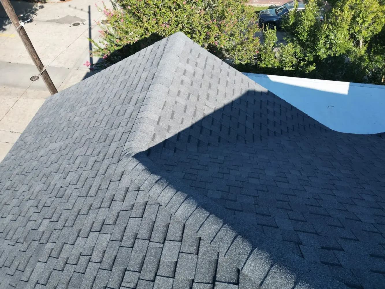 A close view of shingle installation, part of the practical work behind the business